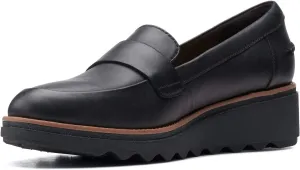 Clarks womens Sharon Gracie Penny Loafer, Black Leather With Dark Tan Welt, 7 US